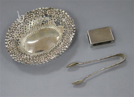 An Edwardian pierced silver trinket dish, 13cm, a pair of sugar tongs and a matchbox holder